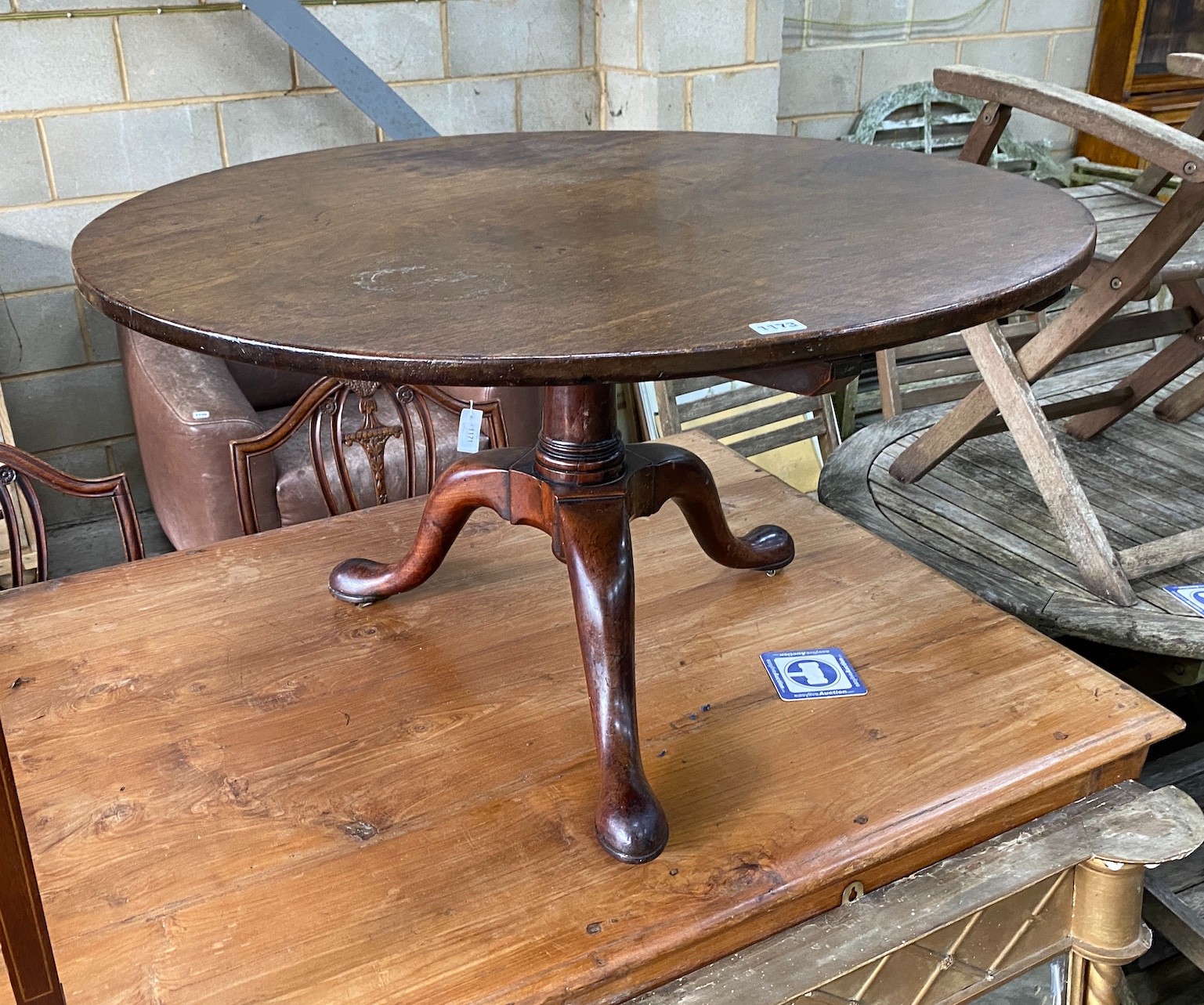 A George III circular mahogany tripod tea table, cut down, diameter 92cm, height 52cm